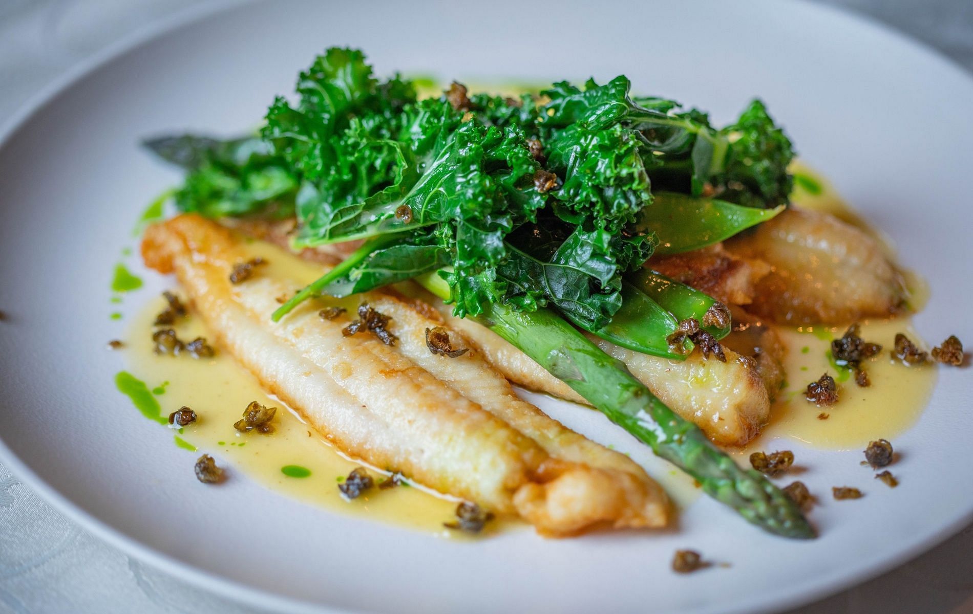 Cod is a white fish that is low in fat. (Image by Valeria Boltneva via Pexels)