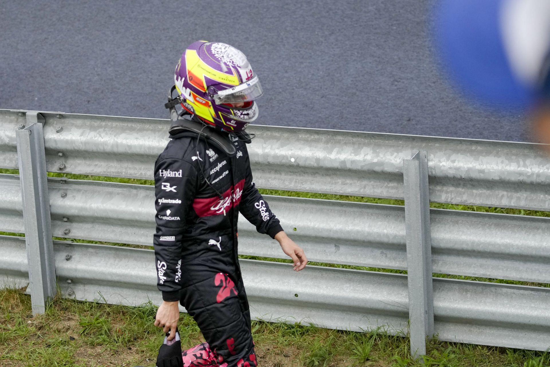 Zhou Guanyu walking out after beaching his Alfa Romeo on the gravel during Dutch Grand Prix FP3 (AP Photo/Peter Dejong)