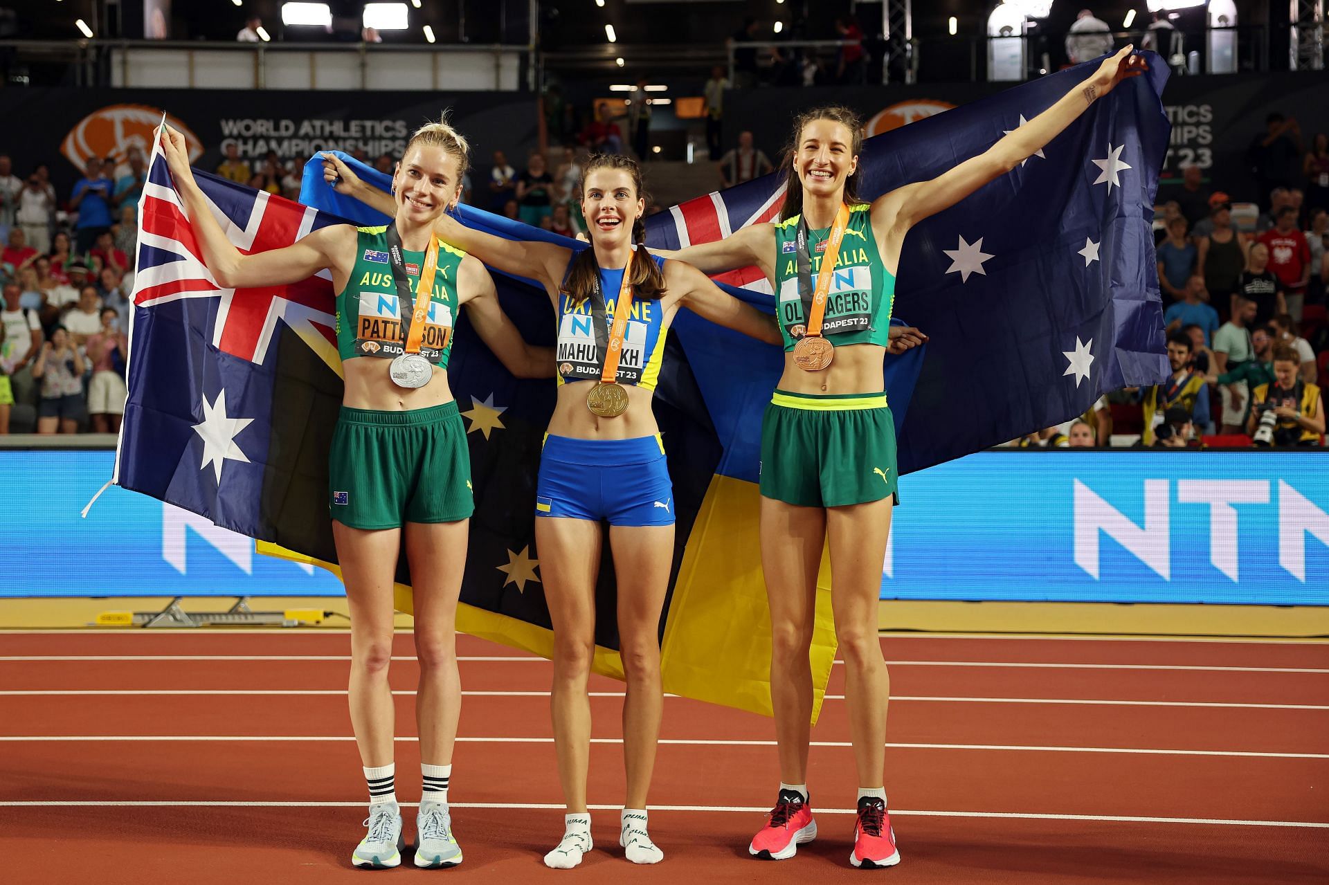 Silver medalist Eleanor Patterson of Team Australia, gold medalist Yaroslava Mahuchikh of Team Ukraine, and bronze medalist Nicola Olyslagers of Team Australia during Day 9 of the 2023 World Athletics Championships