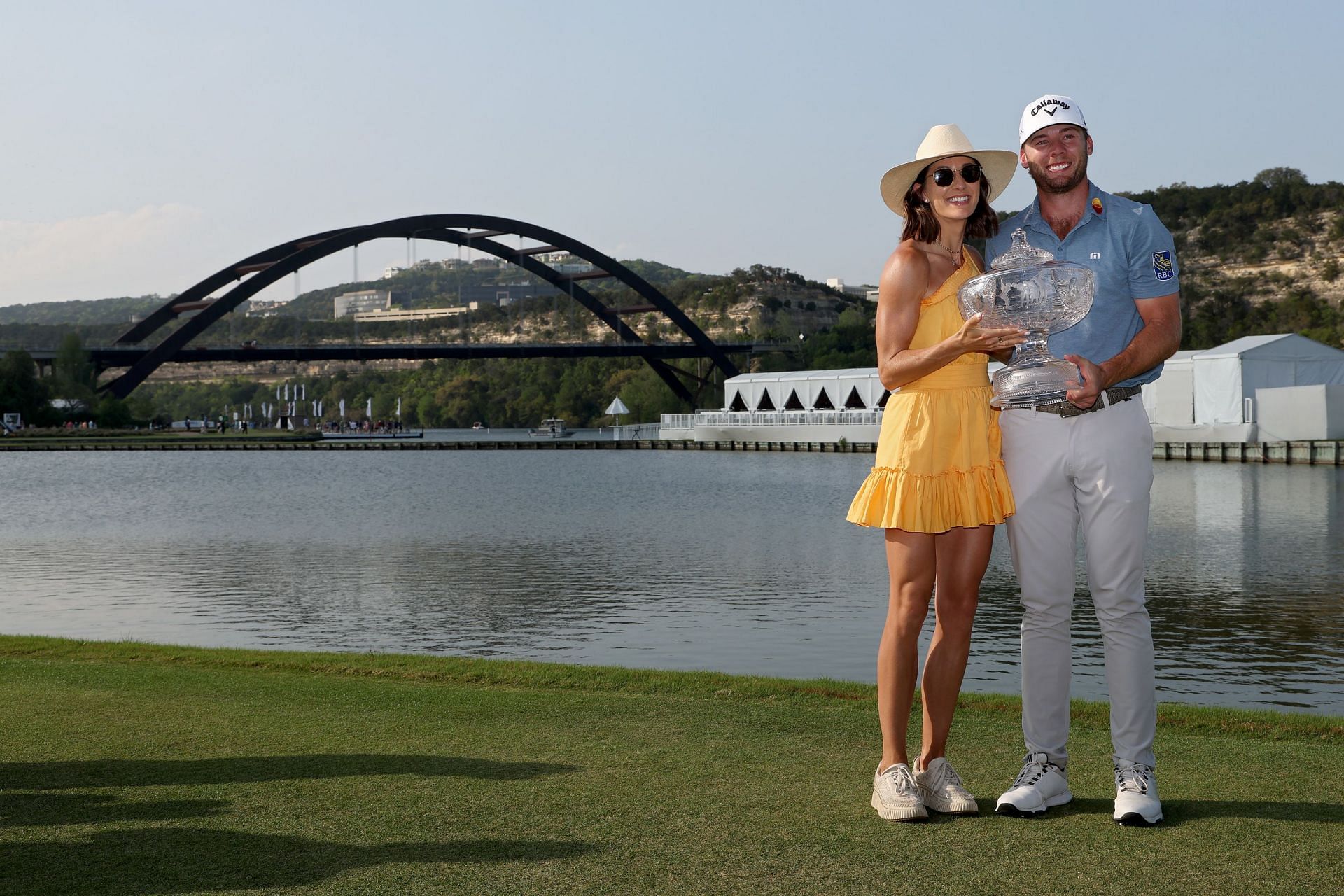 Sam Burns and wife Caroline pose for photos after Burns won the 2023 World Golf Championships-Dell Technologies Match Play at Austin Country Club
