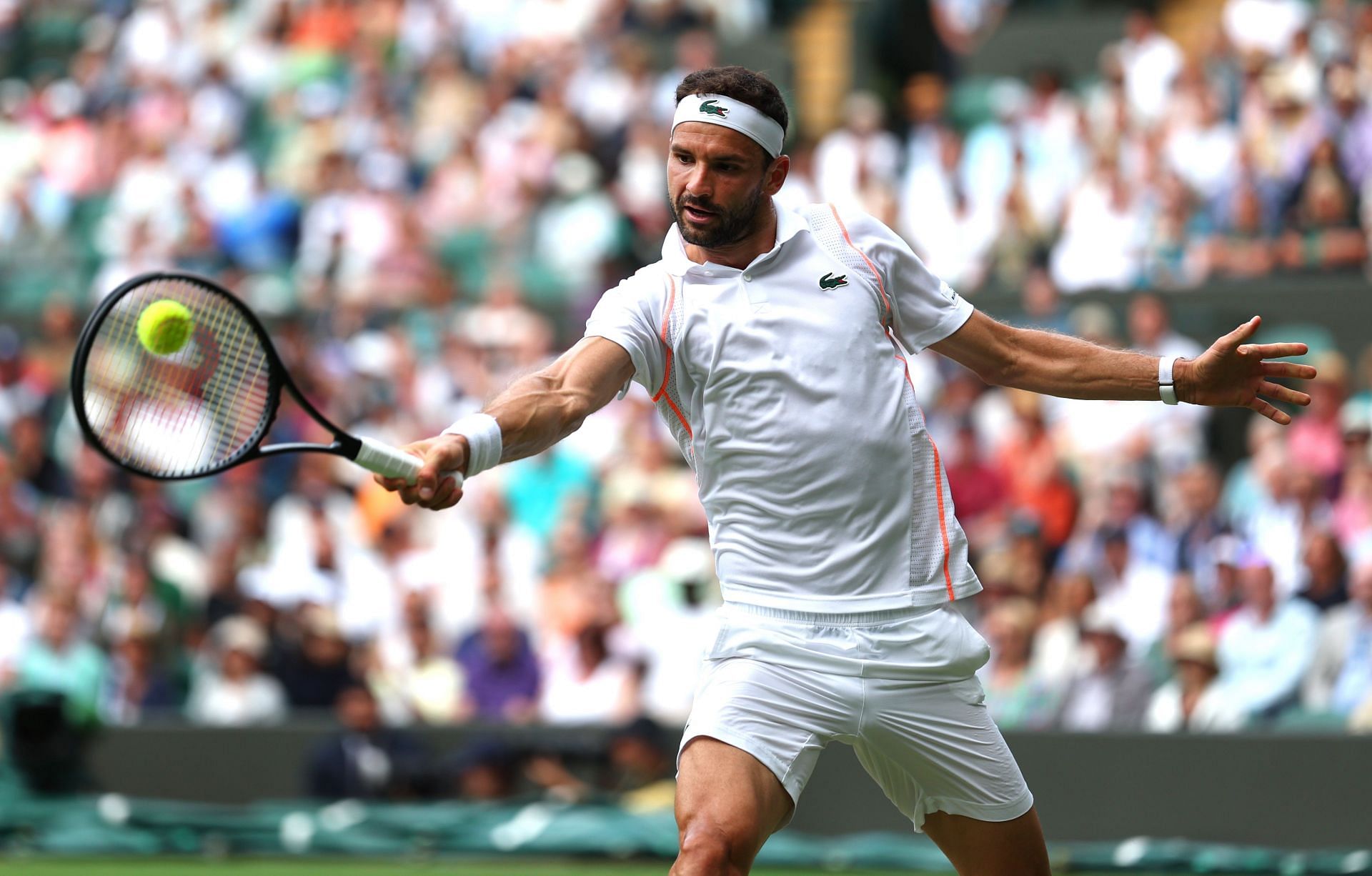 Grigor Dimitrov in action at the 2023 Wimbledon Championships.