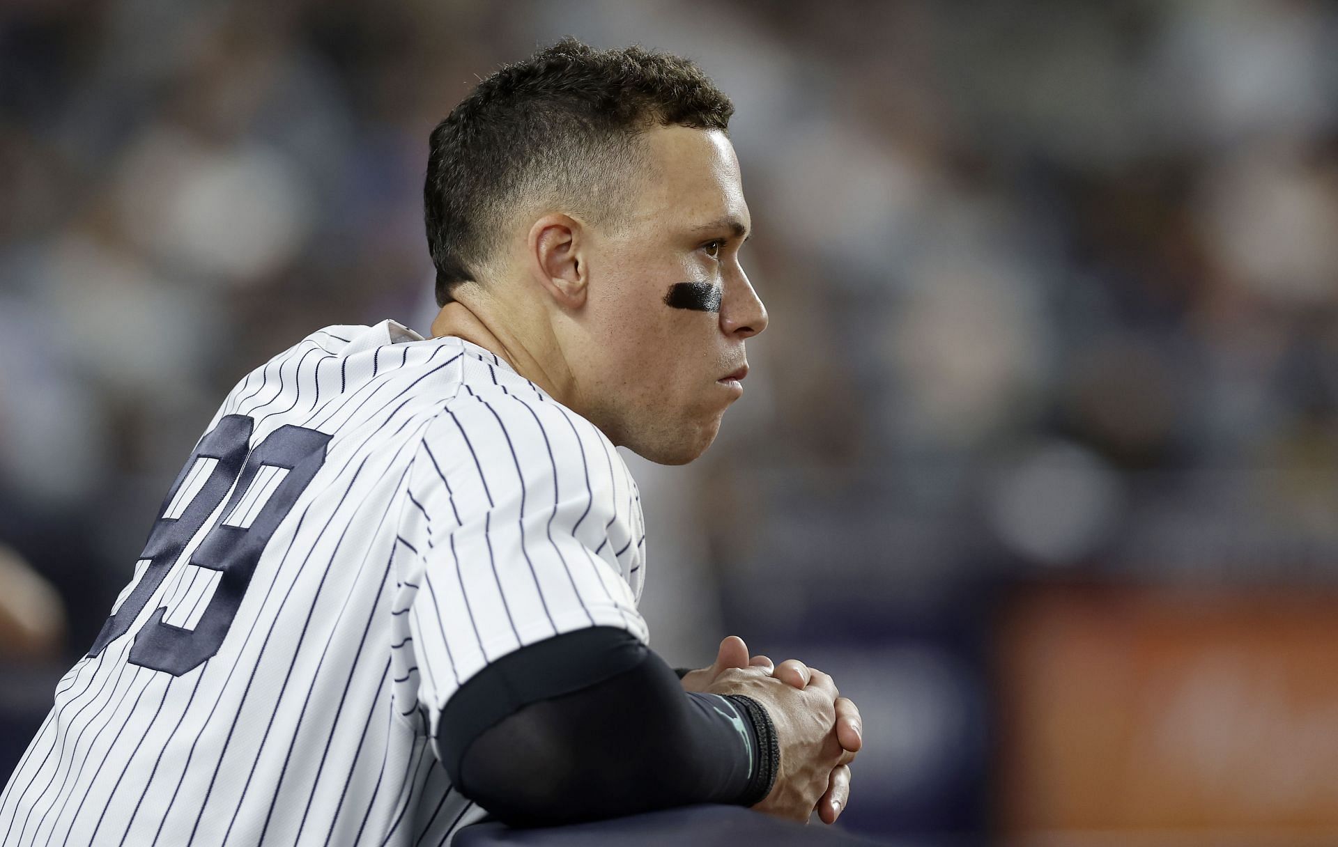 Aaron Judge #99 of the New York Yankees looks on from the dugout during the seventh inning against the Tampa Bay Rays at Yankee Stadium on July 31, 2023 in Bronx borough of New York City. (Photo by Jim McIsaac/Getty Images)