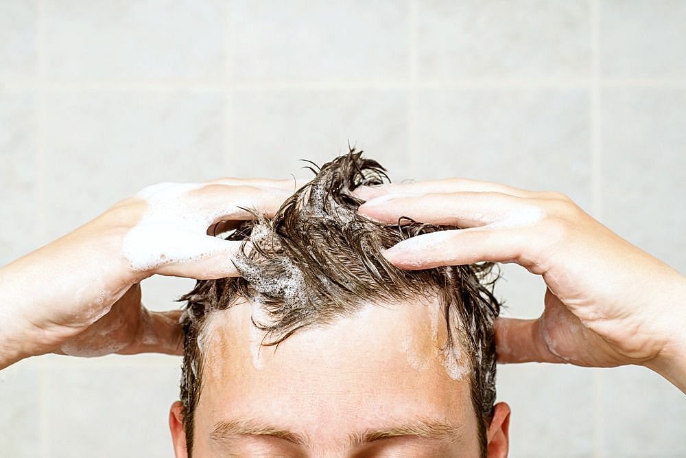 Wash your hair (Image via Getty Images)