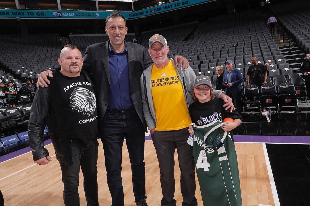 Brett Favre and his grandson, Parker, on the Milwaukee Bucks basketball court,