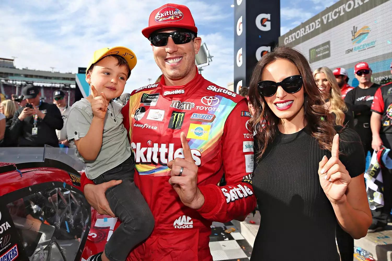 (L-R) Brexton Busch with father and NASCAR Cup Series driver Kyle Busch and spouse Samantha Busch. Picture Credits: Matt Sullivan/Getty Images