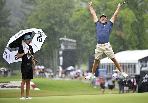 Bryson DeChambeau celebrates his birdie putt on the 18th hole with a record 58 to win the LIV Golf Invitational at Greenbrier