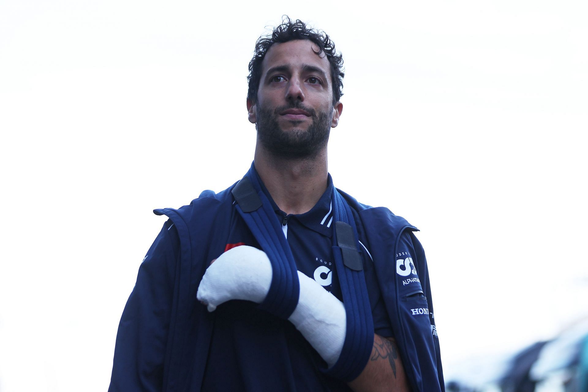 WATCH: Daniel Ricciardo struggles to get out of his AlphaTauri car ...