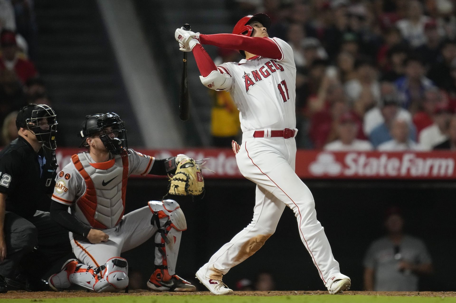 Los Angeles Angels designated hitter Shohei Ohtani (17) flies out during the seventh inning of a baseball game against the San Francisco Giants in Anaheim, Calif., Monday, Aug. 7, 2023. (AP Photo/Ashley Landis)