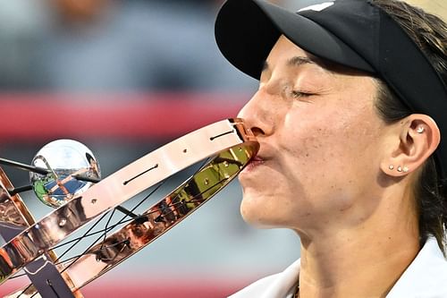 Jessica Pegula kisses the Canadian Open trophy.