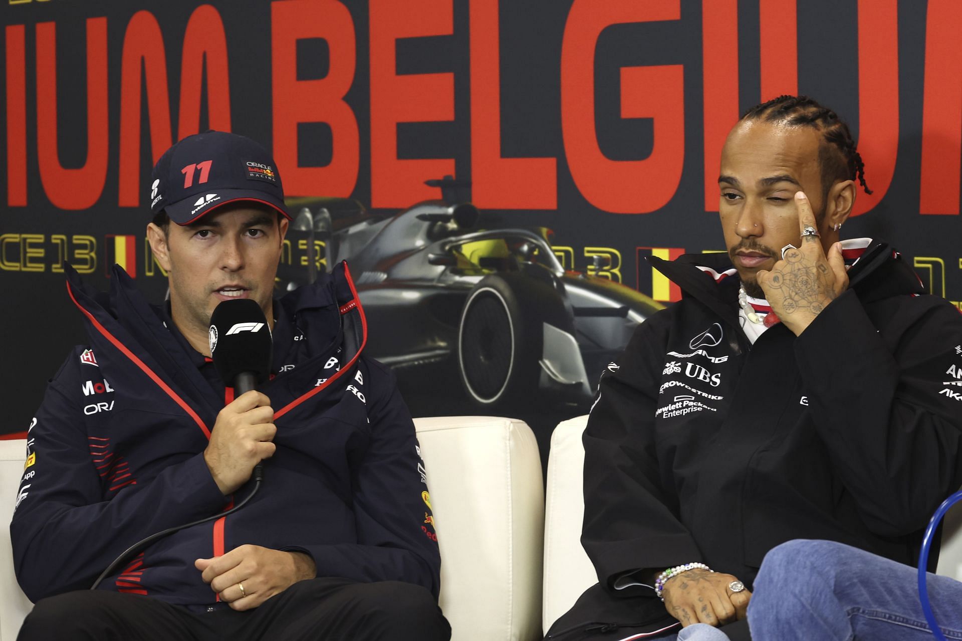 Belgium F1 GP Auto Racing - Sergio Perez and Lewis Hamilton