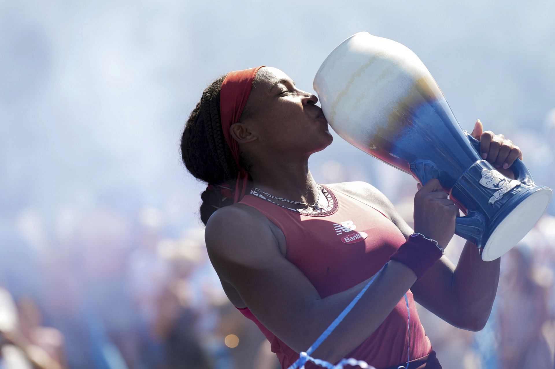 Coco Gauff kissing the Rookwood Cup after winning the 2023 Cincinnati Open