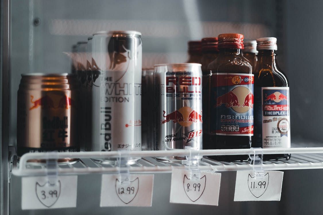 Given their similarity in look and composition, several experts contend that there appears to be a regulatory vacuum in the case of caffeinated beverages and energy drinks. (Erik Mclean/ Pexels)