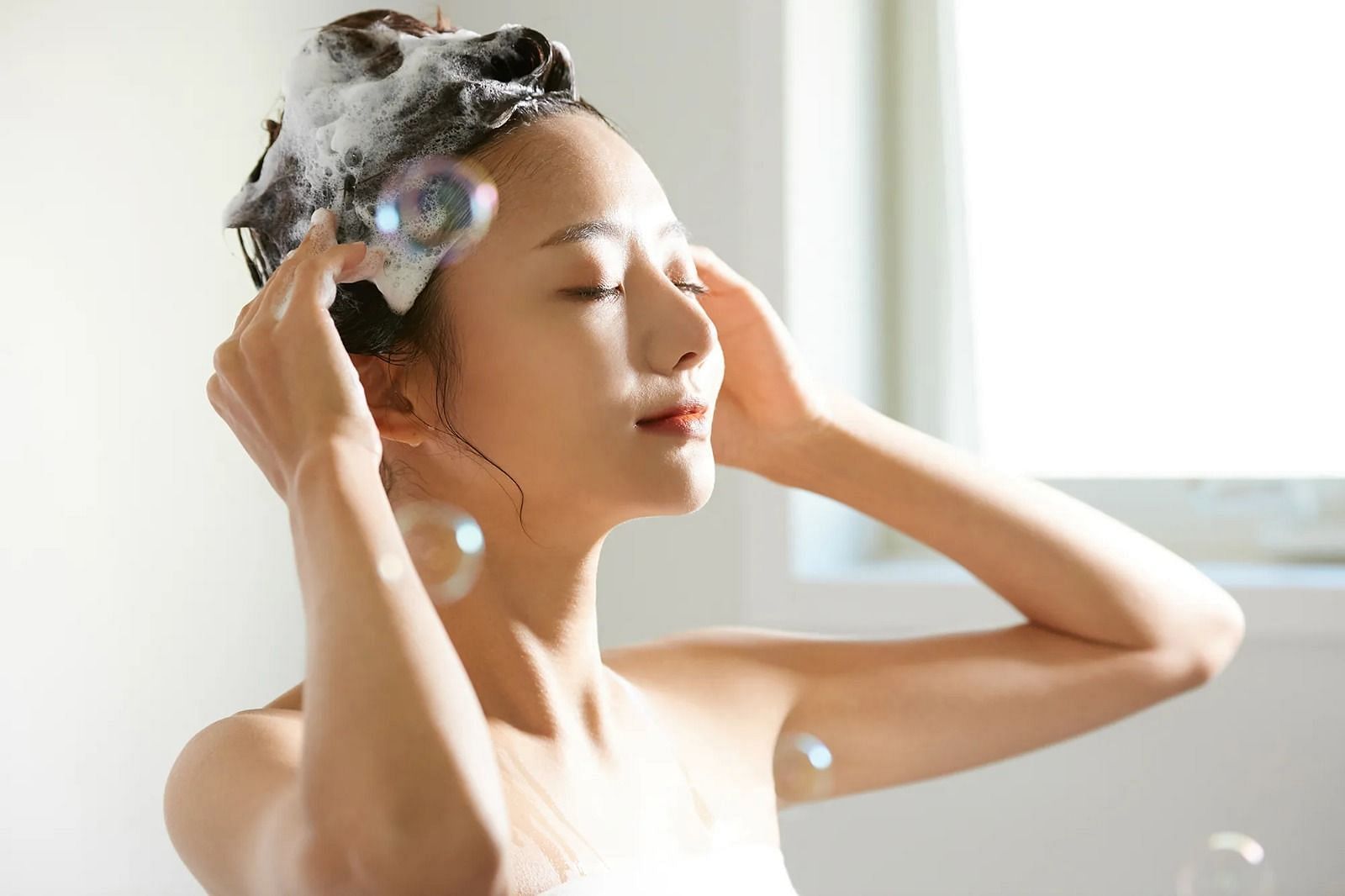 Wash your hair (Image via Getty Images)