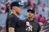 New York Yankees' Aaron Judge talks with manager Aaron Boone in Anaheim,