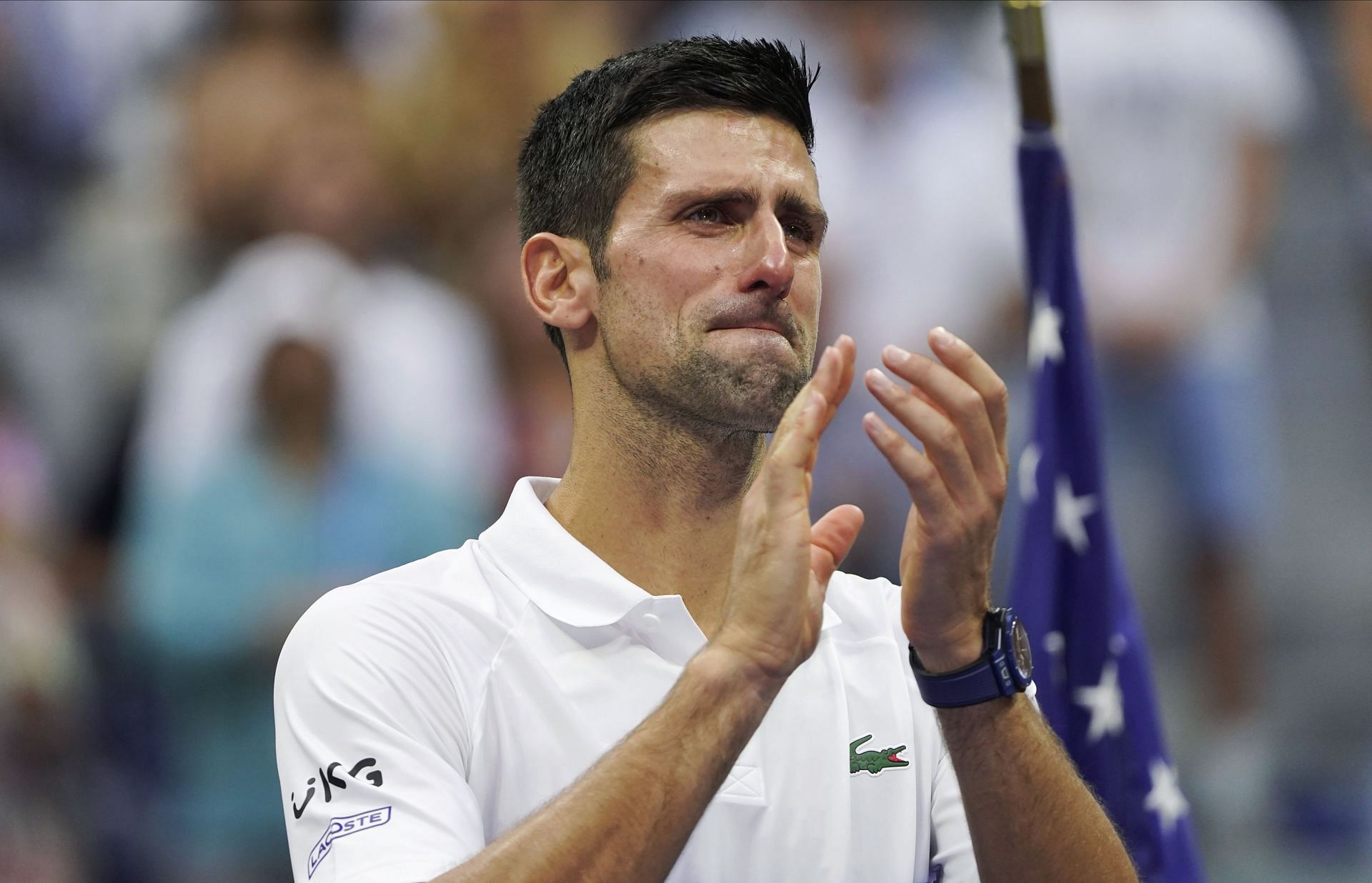 Novak Djokovic reacts to the crowd