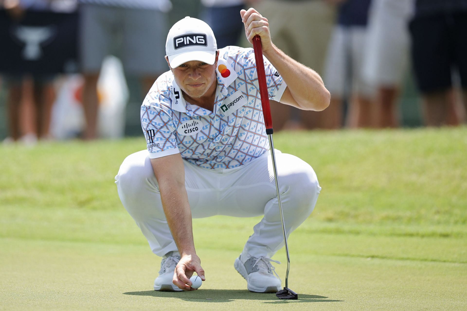Viktor Hovland lines up a putt during the first round of the 2023 Tour Championship