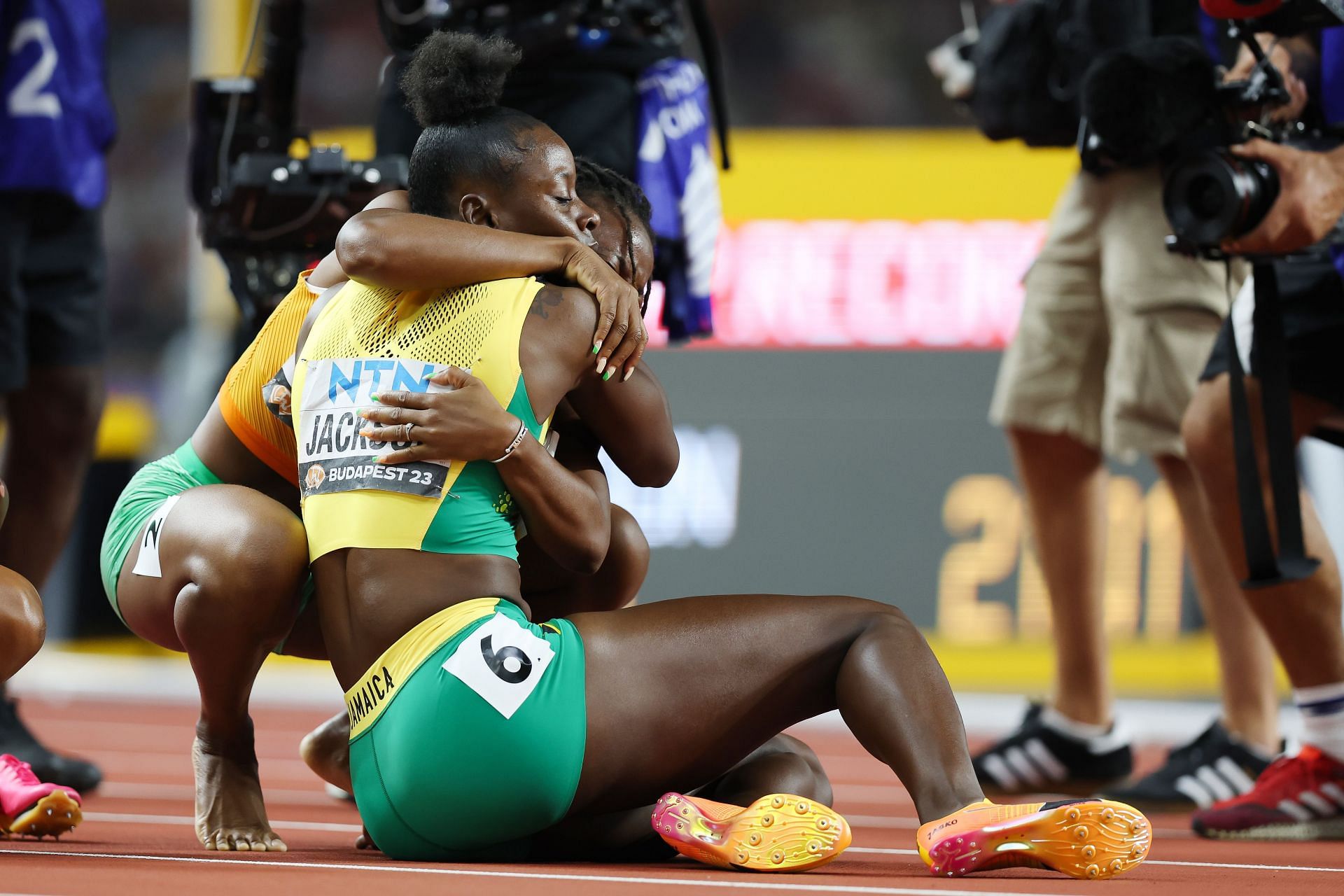 Shericka Jackson receives hugs from rival Sha'Carri Richardson on winning  200m at World Athletics Championships