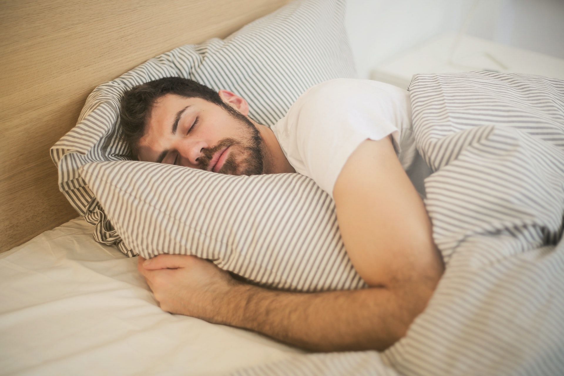 Sleeping too much or too little (Photo via Pexels/Andrea Piacquadio)