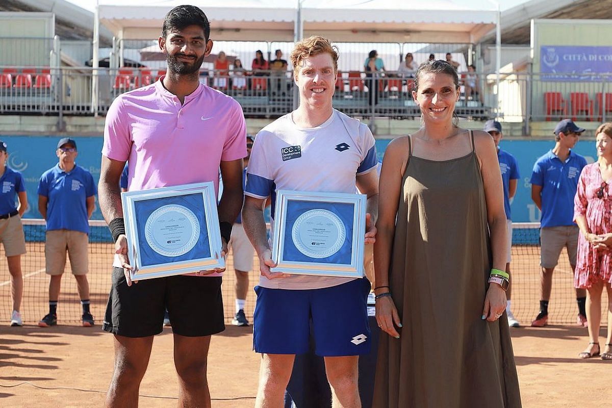 Niki Poonacha and Adam Taylor with their runners-up trophy (Image: The First Serve)
