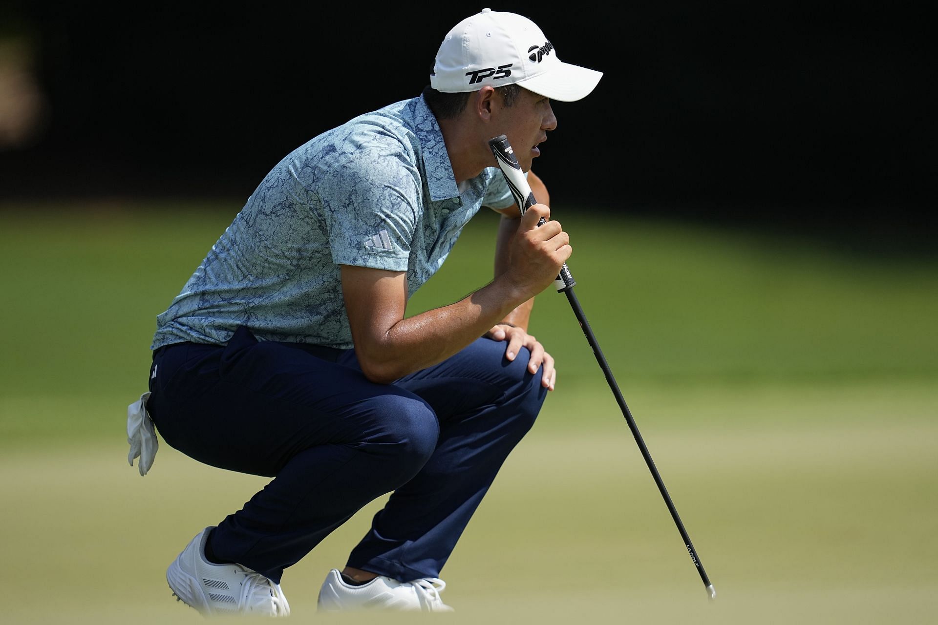 Collin Morikawa lines up a putt on the seventh green during the second round of the Tour Championship