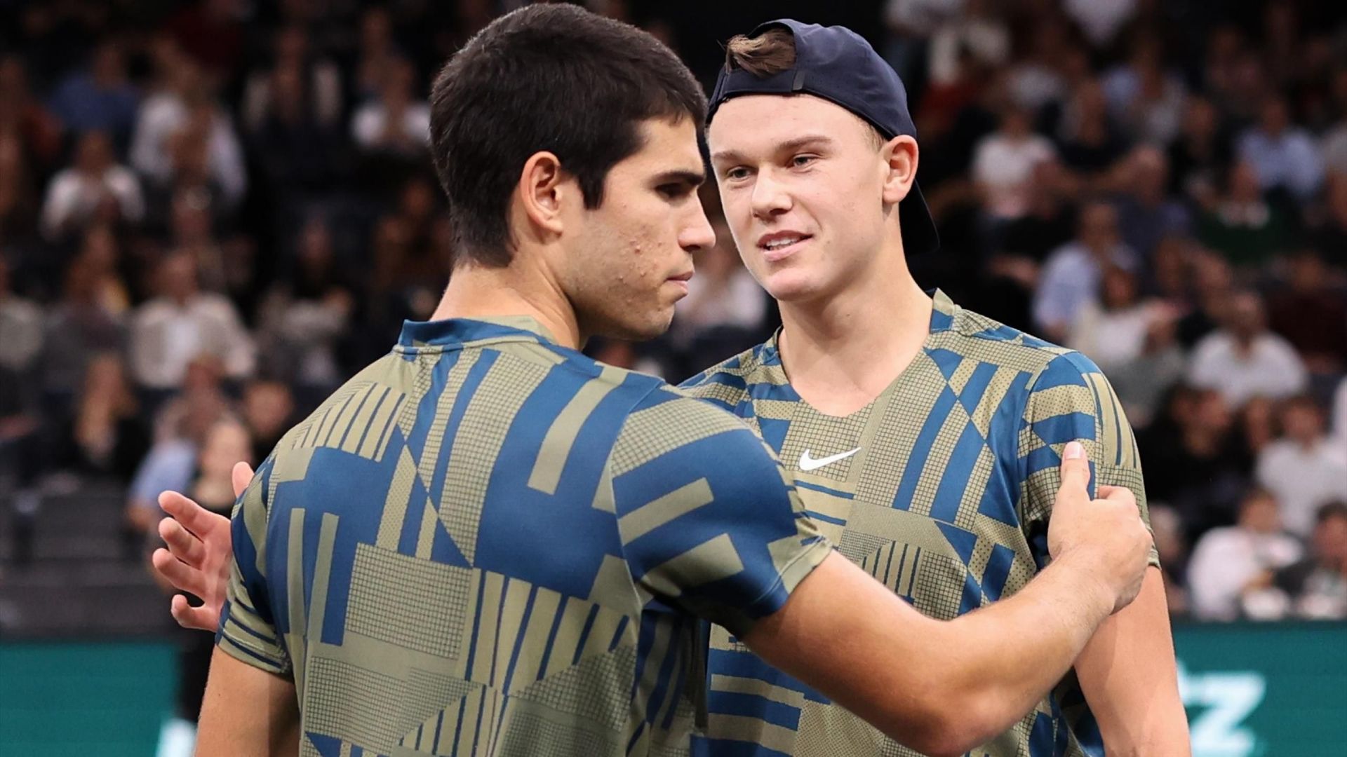 Carlos Alcaraz and Holger Rune embrace at the 2022 Paris Masters