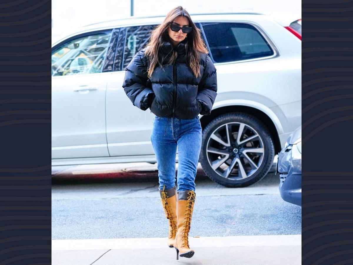 Emily Ratajkowski in a puffer jacket and denim (Image via Getty)