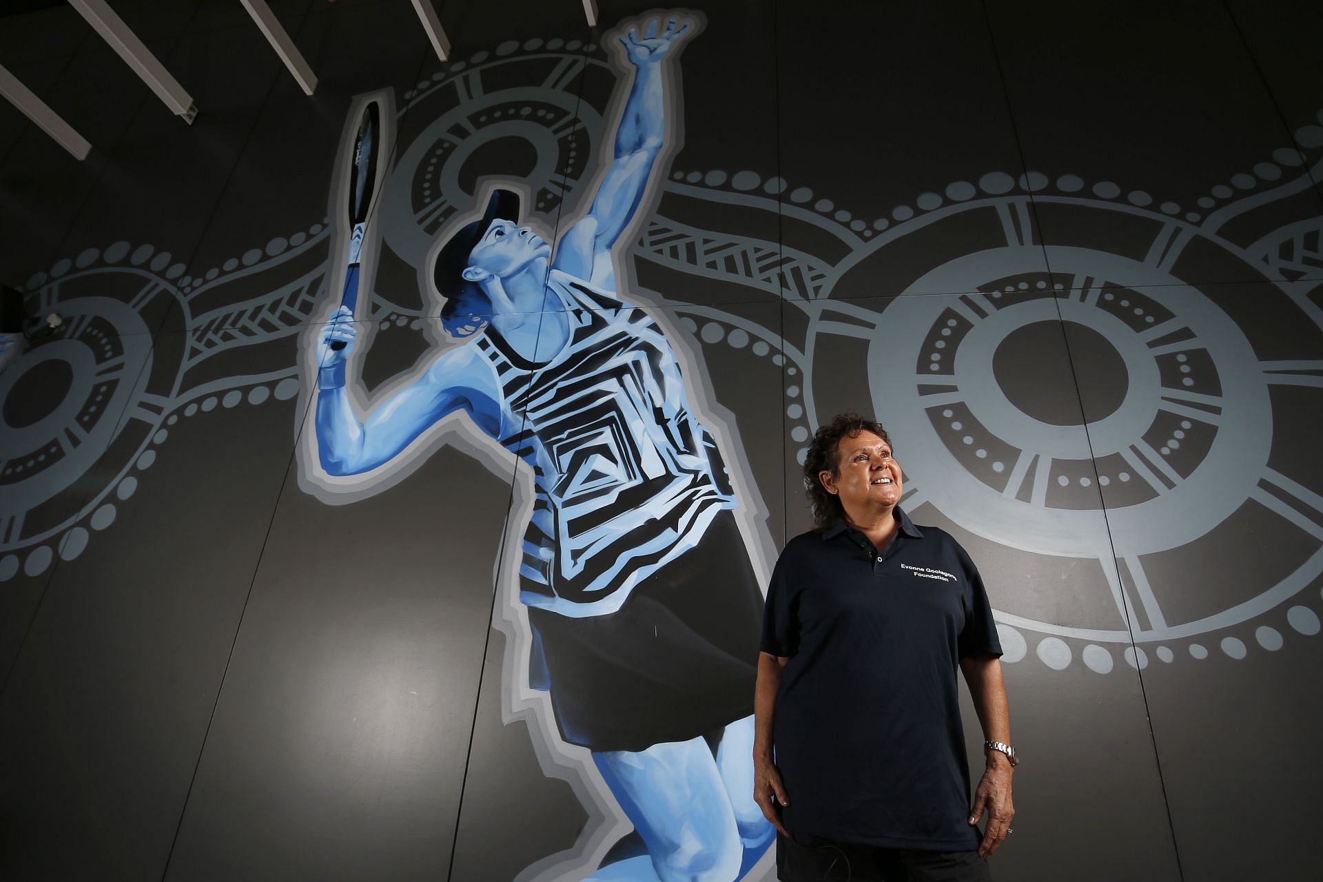 Evonne Goolagong Cawley in front of her mural at the National Indigenous Tennis Carnival in Australia