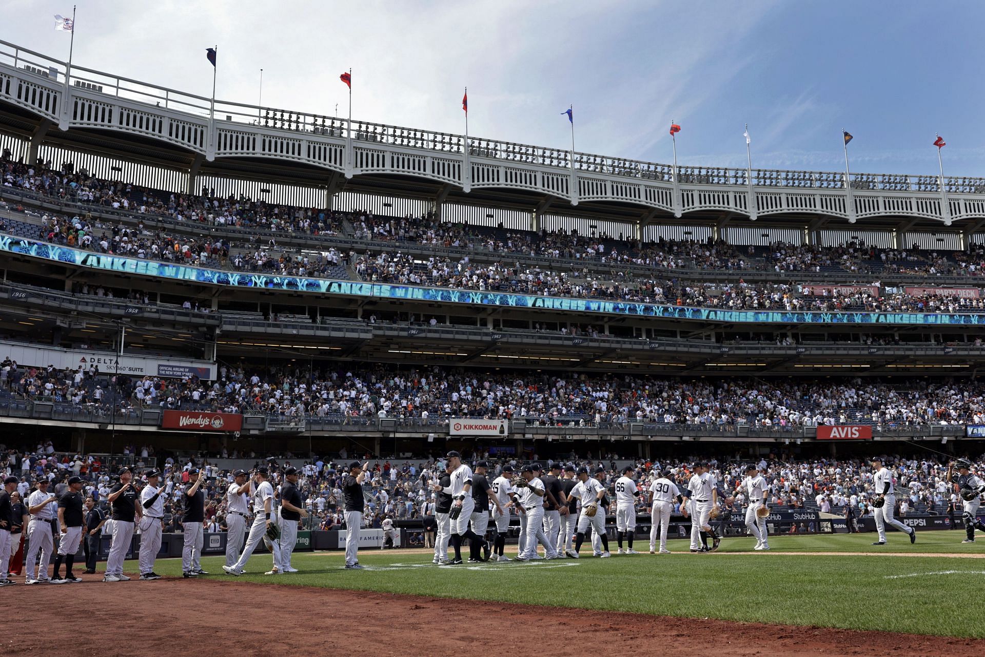 New York Yankees celebrate after defeating the Houston Astros at Yankee Stadium