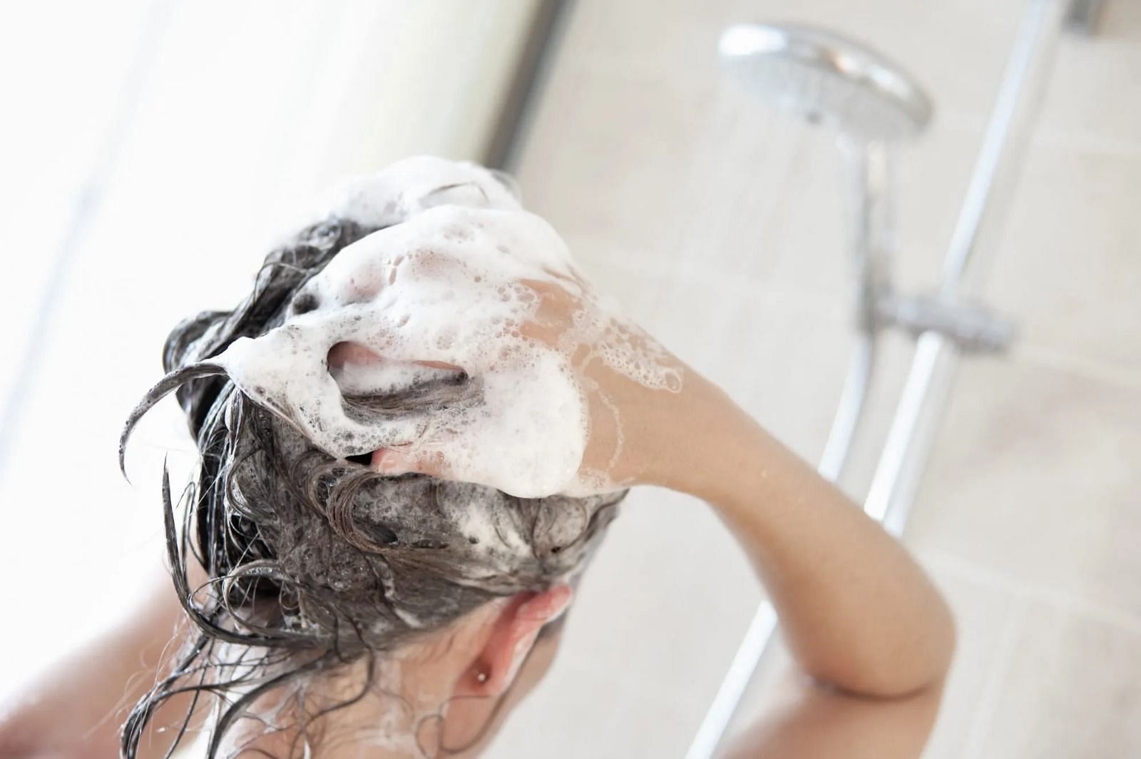 Wash your hair (Image via Getty Images)