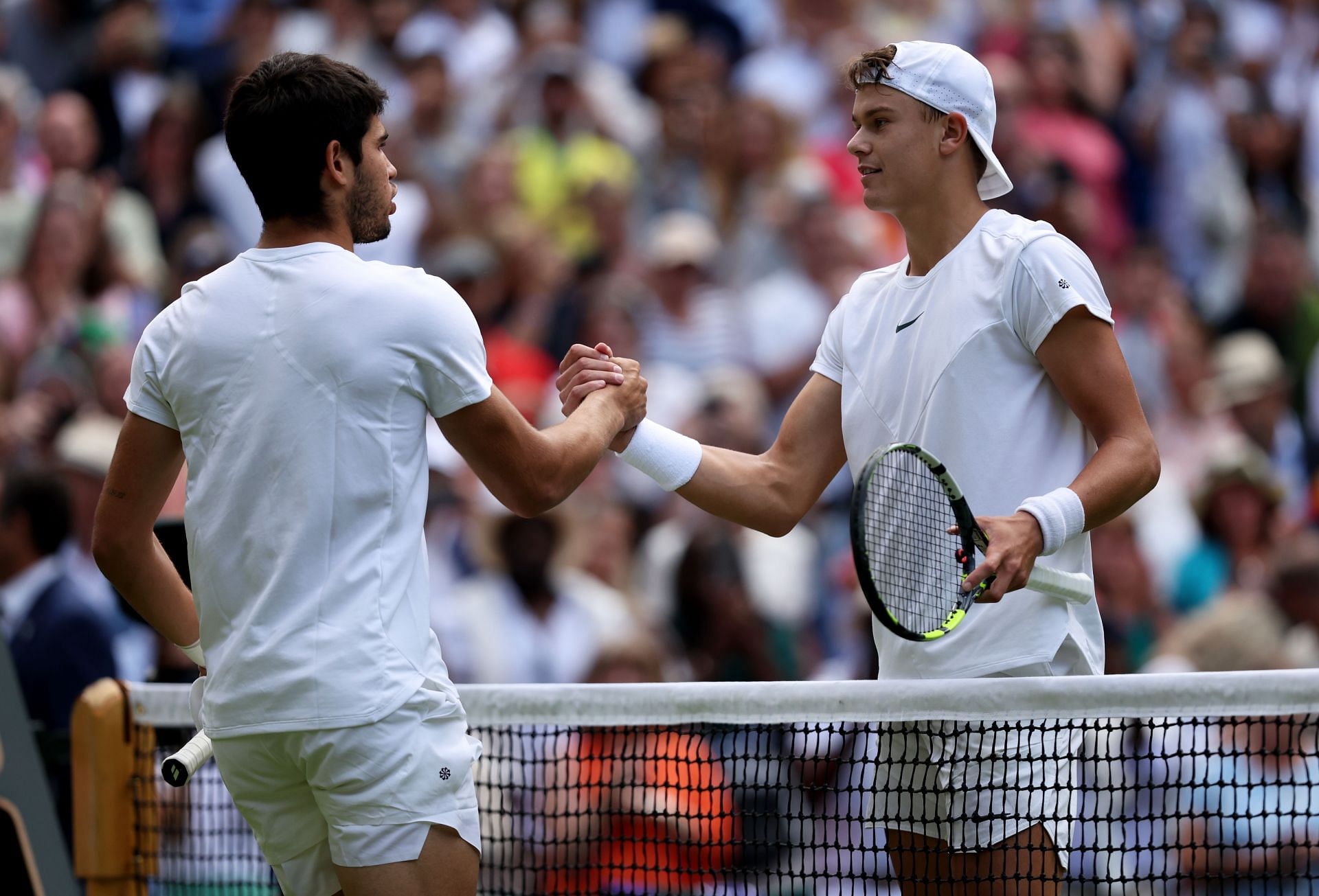 Carlos Alcaraz greets Holger Rune: Wimbledon 2023