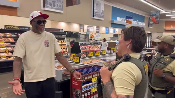 Five-time champion Dennis Rodman, sporting girlfriend's face tattoo on his a**, got the cops called on him while grocery shopping