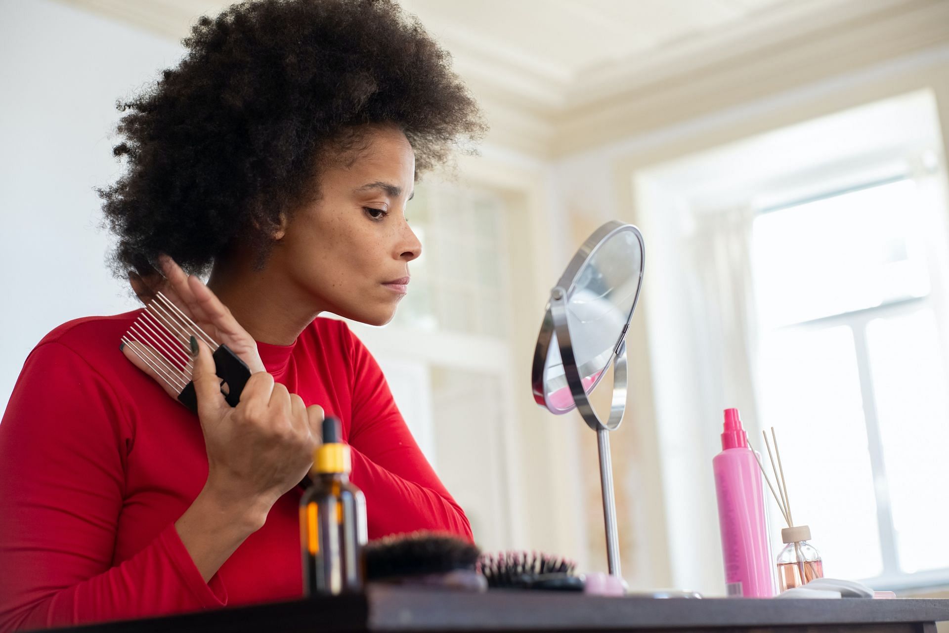 Use a comb instead of brush. (Image via Pexels/Kampus Production)