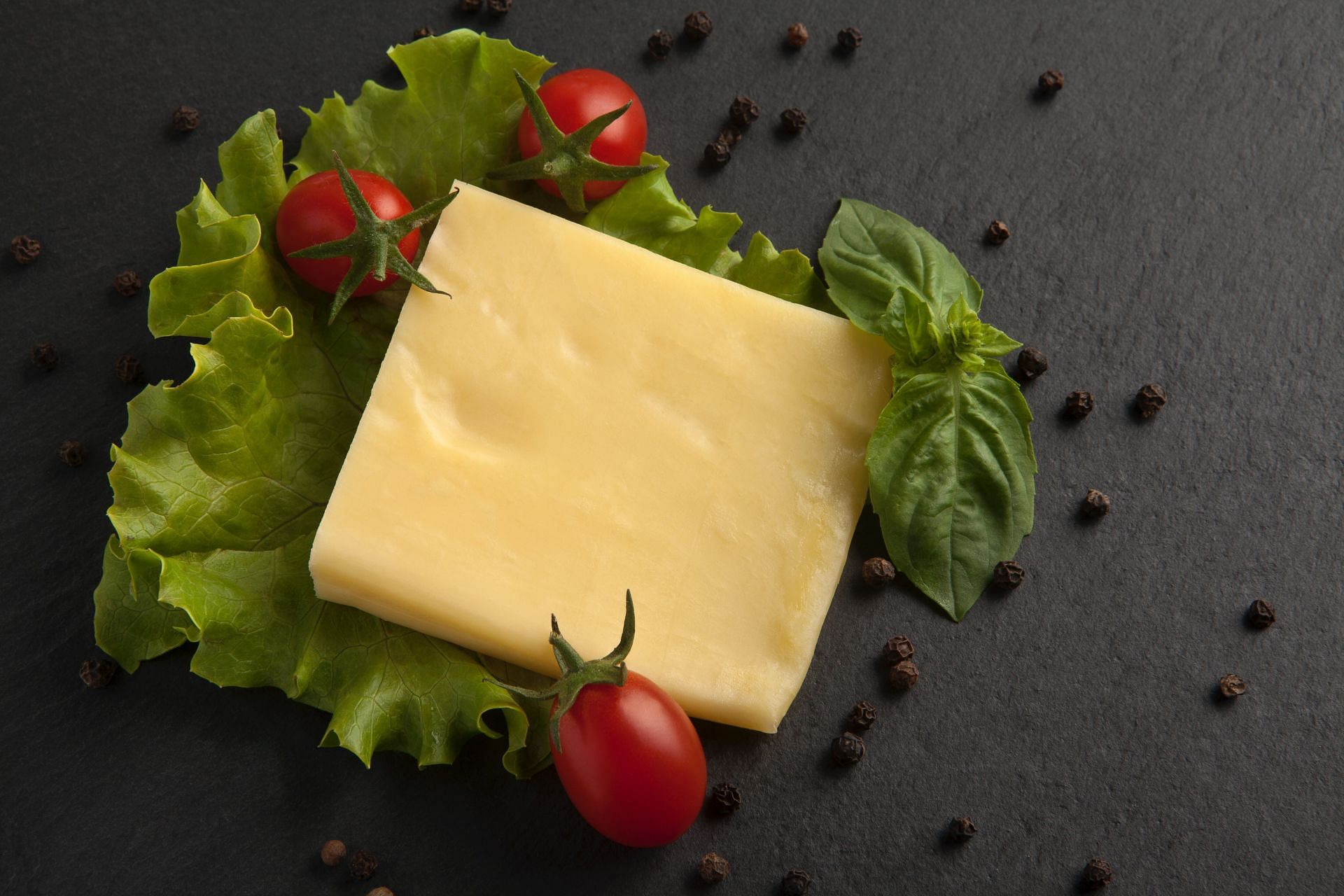 Cheddar is a popular cheese high in protein (Image via Unsplash/Onder Ortel)