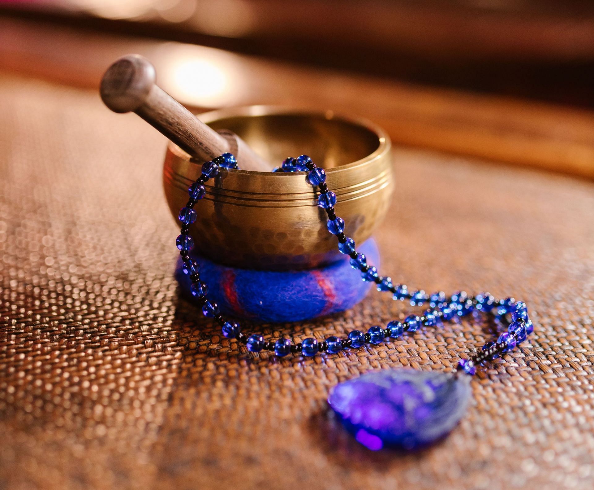 Using mala beads for meditation (Image via Pexels / Rdne Stock roject)