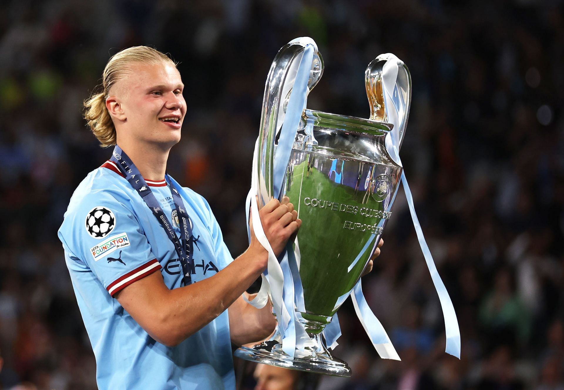 Erling Haaland celebrates with the UEFA Champions League trophy