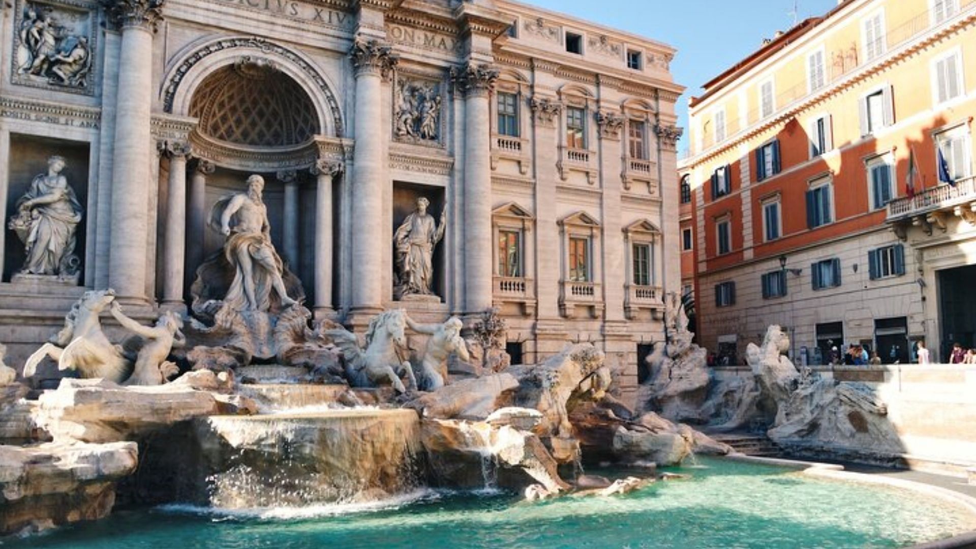 Woman crosses the Trevi Fountain in Rome to fill water bottle. (Image via tripadvisor.com)