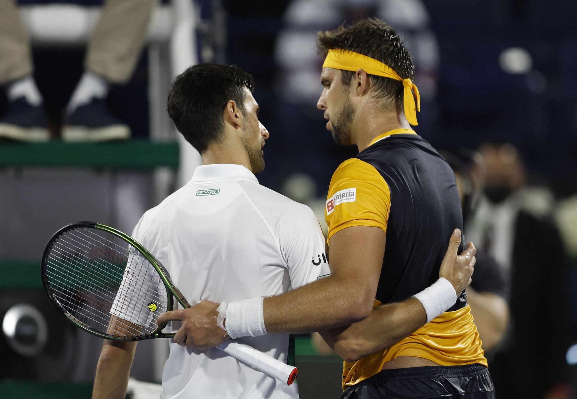 Vesely embraces Djokovic after defeating him in Dubai last year