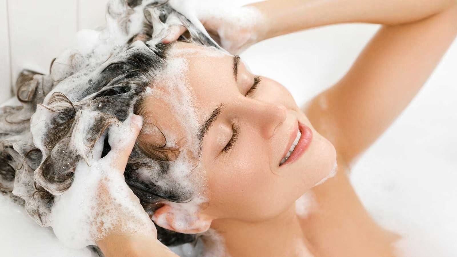 Wash your hair (Image via Getty Images)