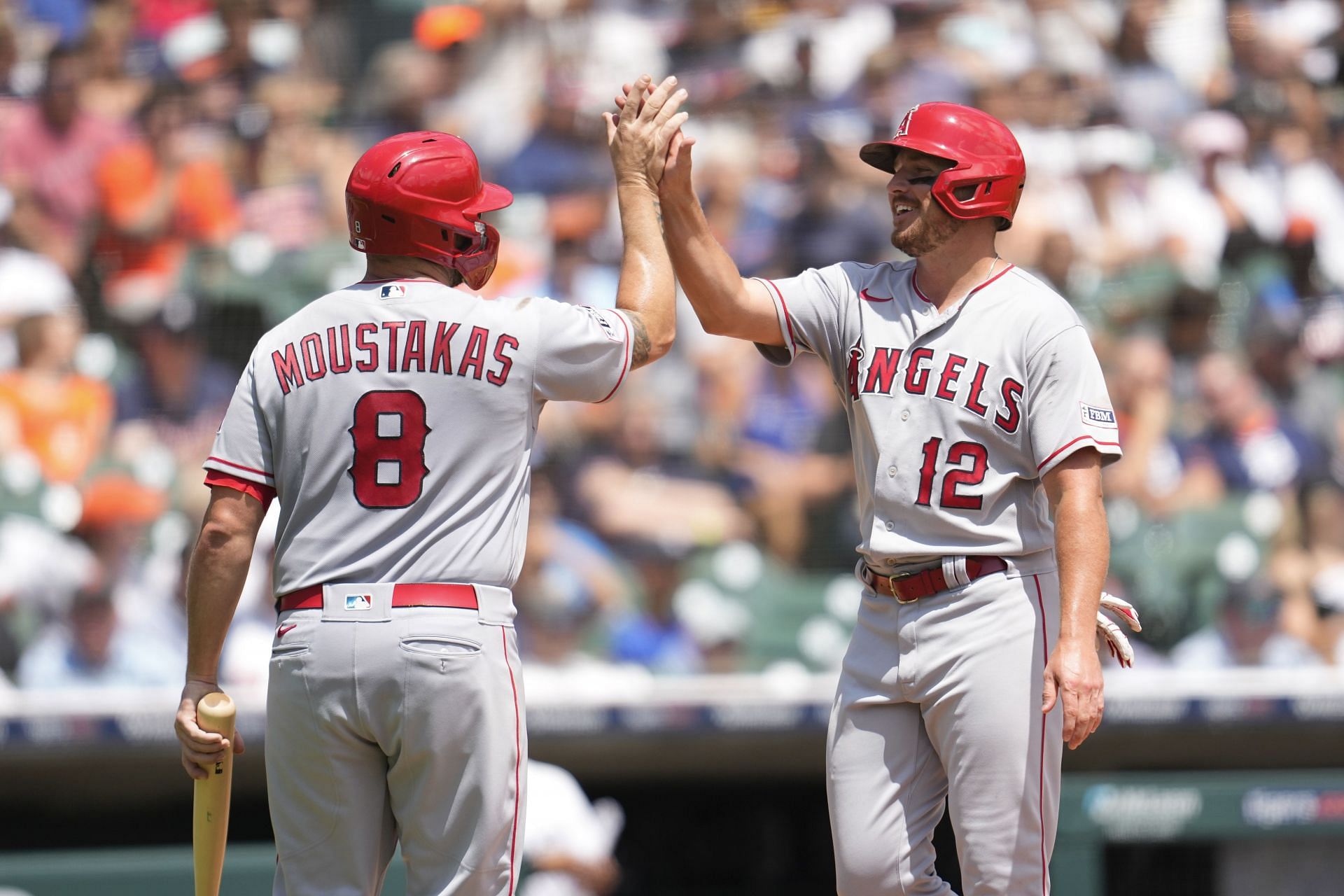 Los Angeles Angels&#039; Mike Moustakas and Hunter Renfroe celebrate scoring against the Detroit Tigers