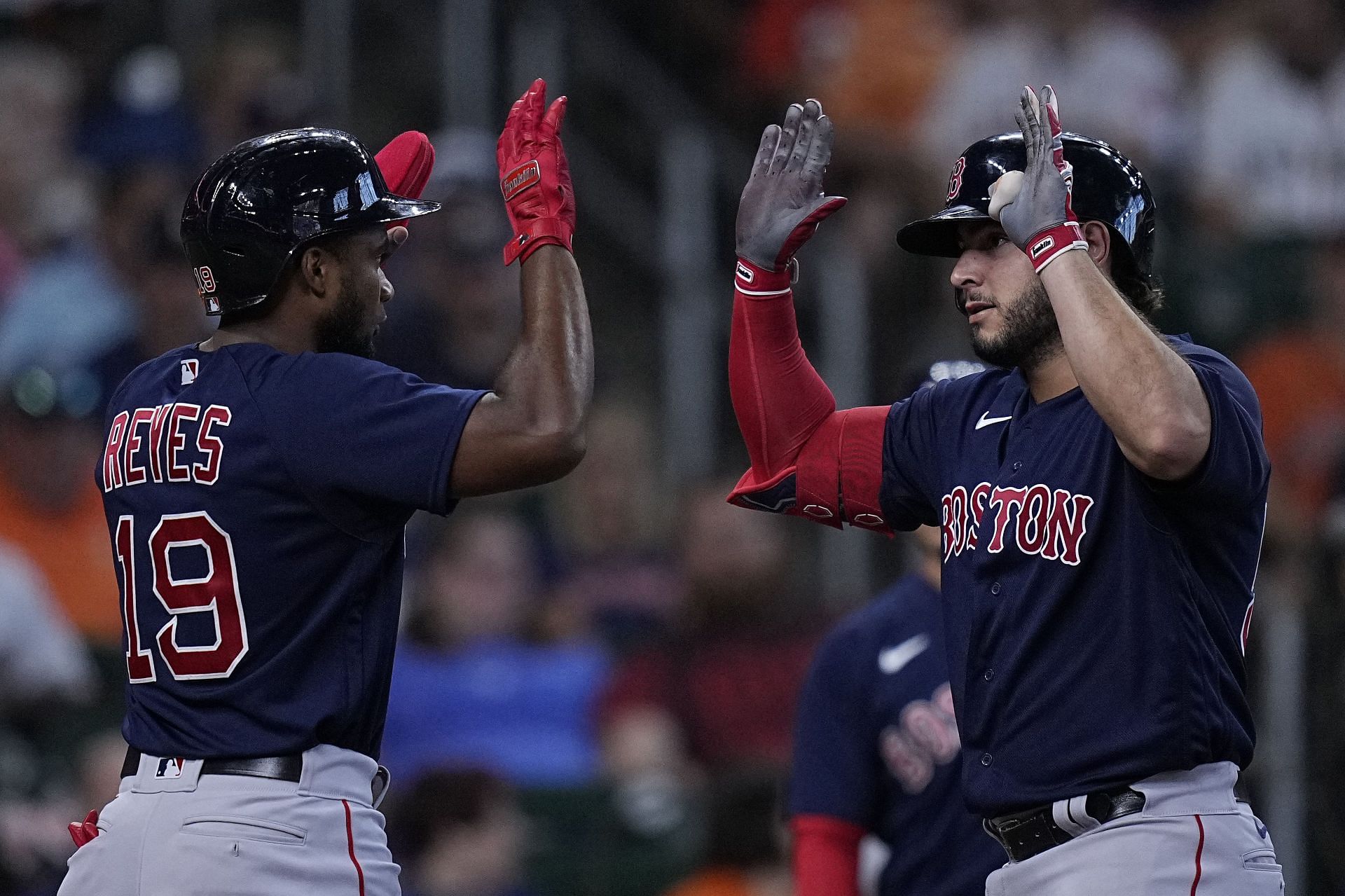 Boston Red Sox 2B Pablo Reyes removes his helmet after recording