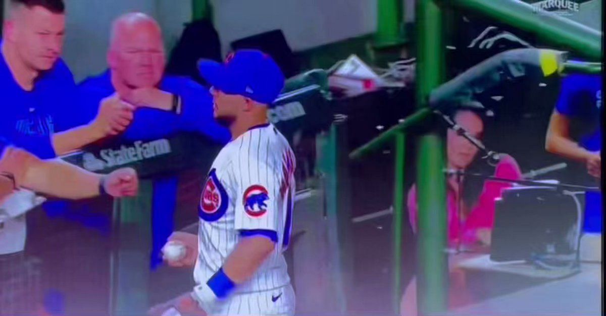 The Chicago Cubs' Seiya Suzuki (R) sits in the dugout after striking out in  the seventh inning of a baseball game against the Arizona Diamondbacks on  May 22, 2022, at Wrigley Field