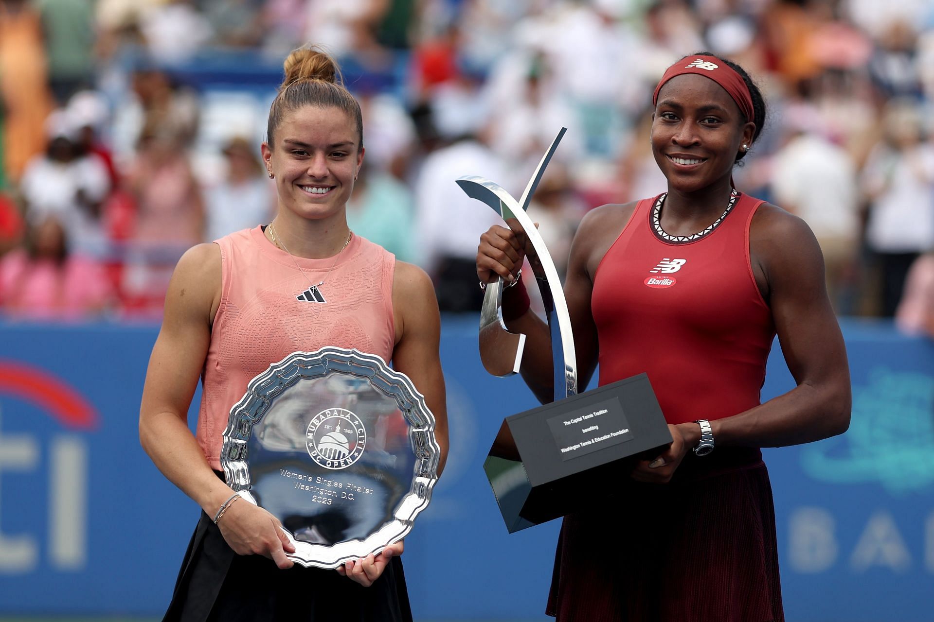 Maria Sakkari and Coco Gauff with their respective Citi Open trophies.