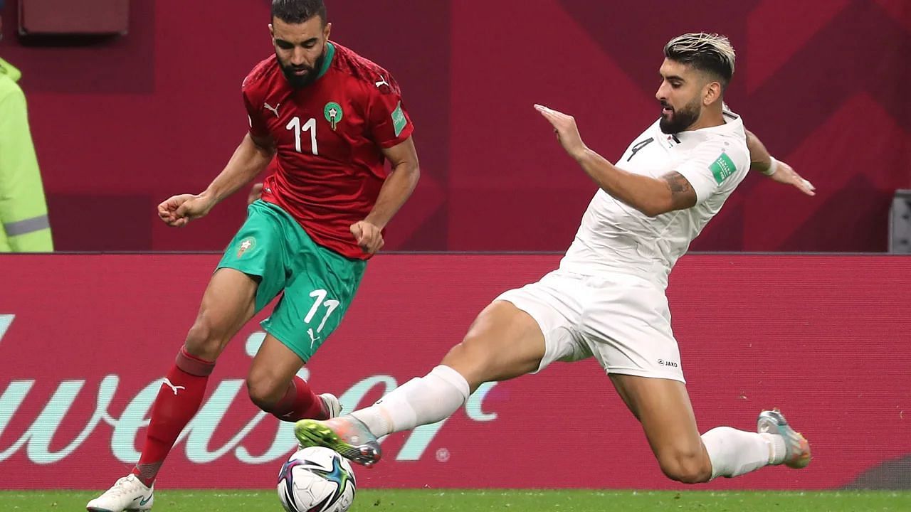 Yaser Hamed (in white) vies for the ball with a Moroccan player in an Arab Cup game (Credits: CNN)