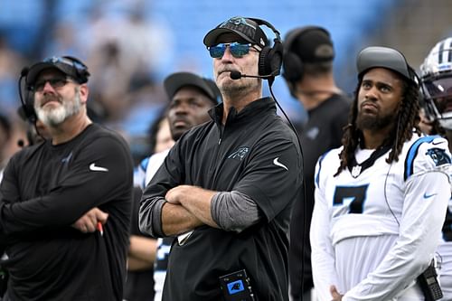 Frank Reich (center) of the Carolina Panthers