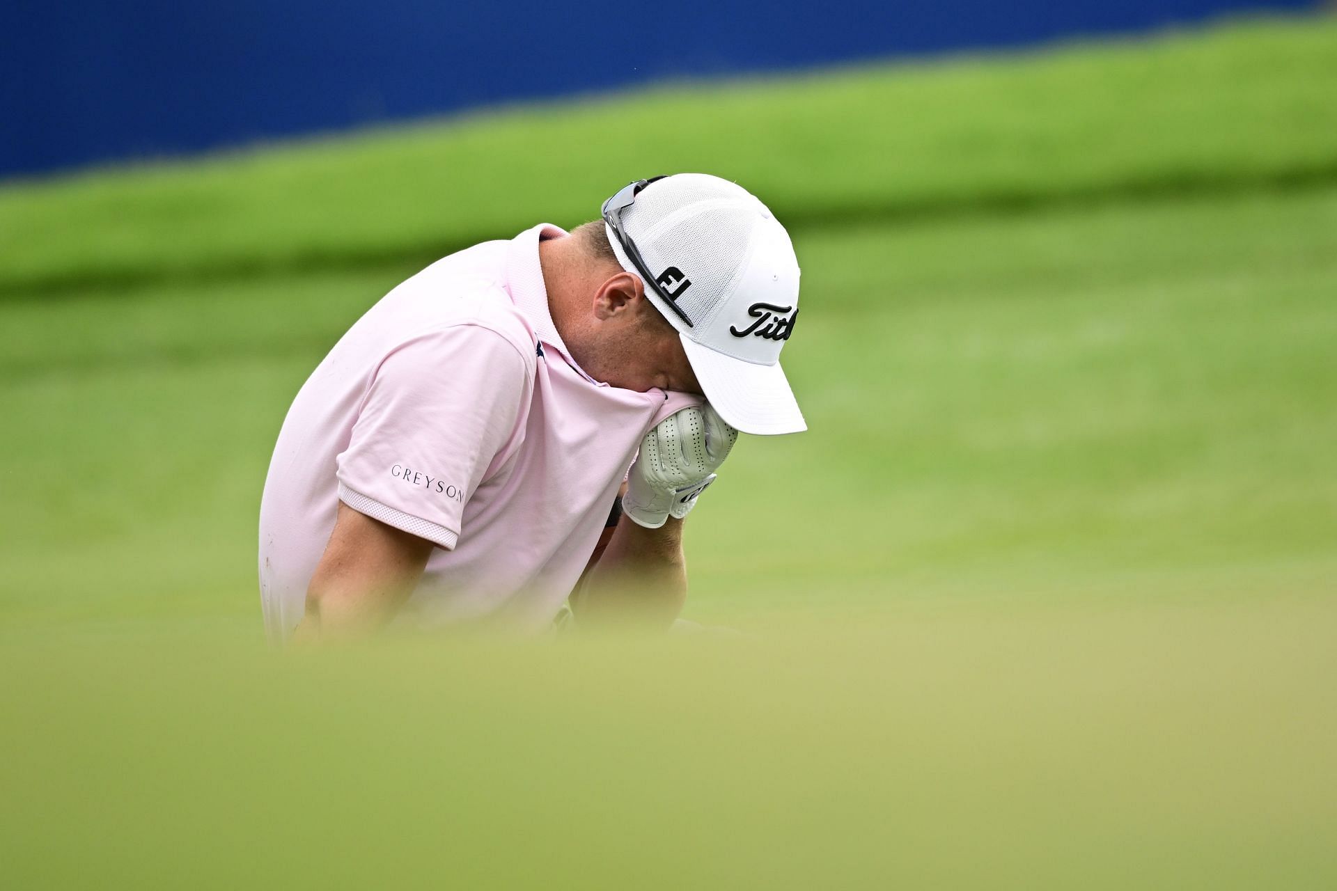 Justin Thomas reacts after a shot on the 18th green during the final round of the Wyndham Championship