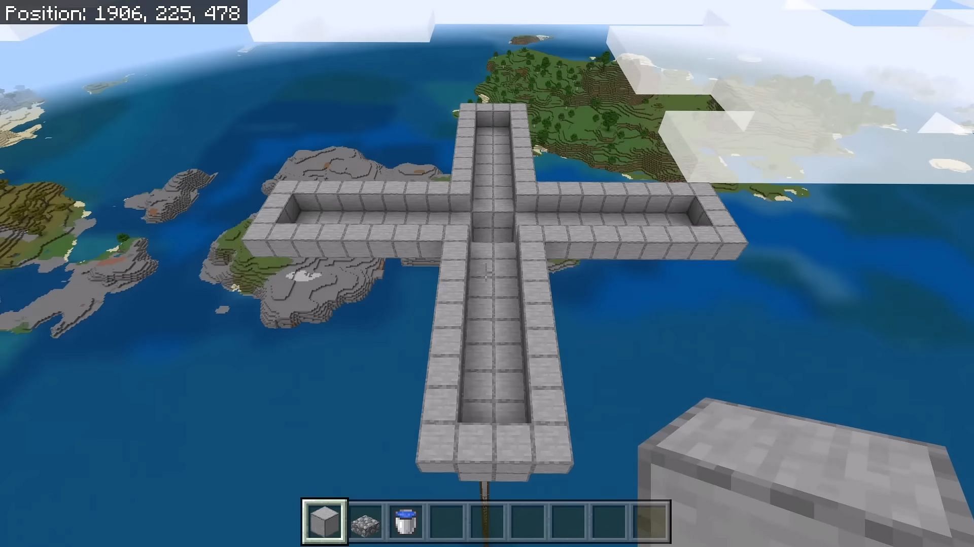 An in-progress Minecraft mob tower featuring the needed columns that will later become water channels (Image via JC Playz/YouTube)