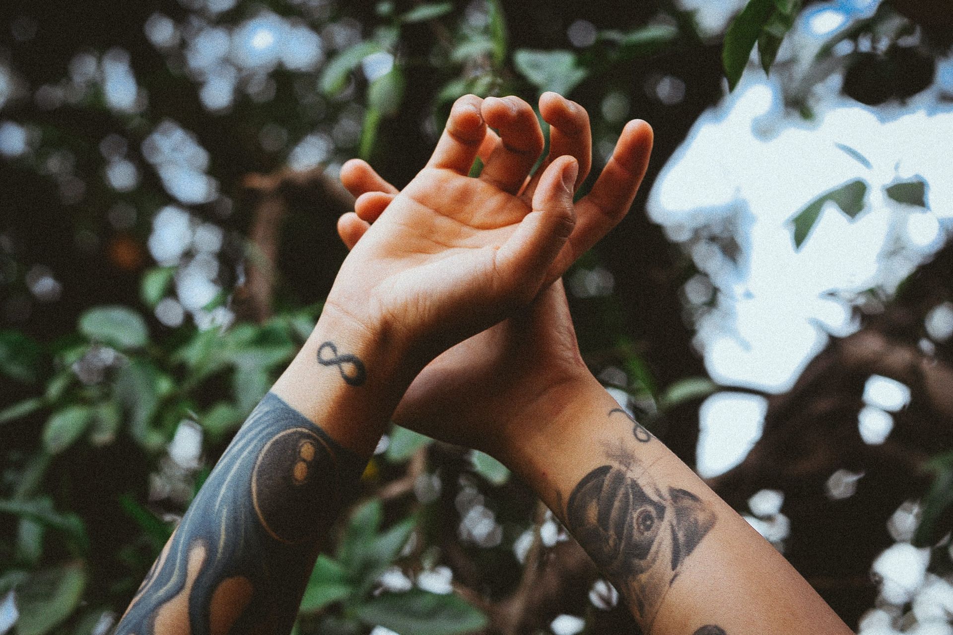 Infinity in itself carries a lot of weight and meaning. When combined with mental health, it becomes a very powerful tattoo. (Image via Unsplash/Matheus Ferrero)
