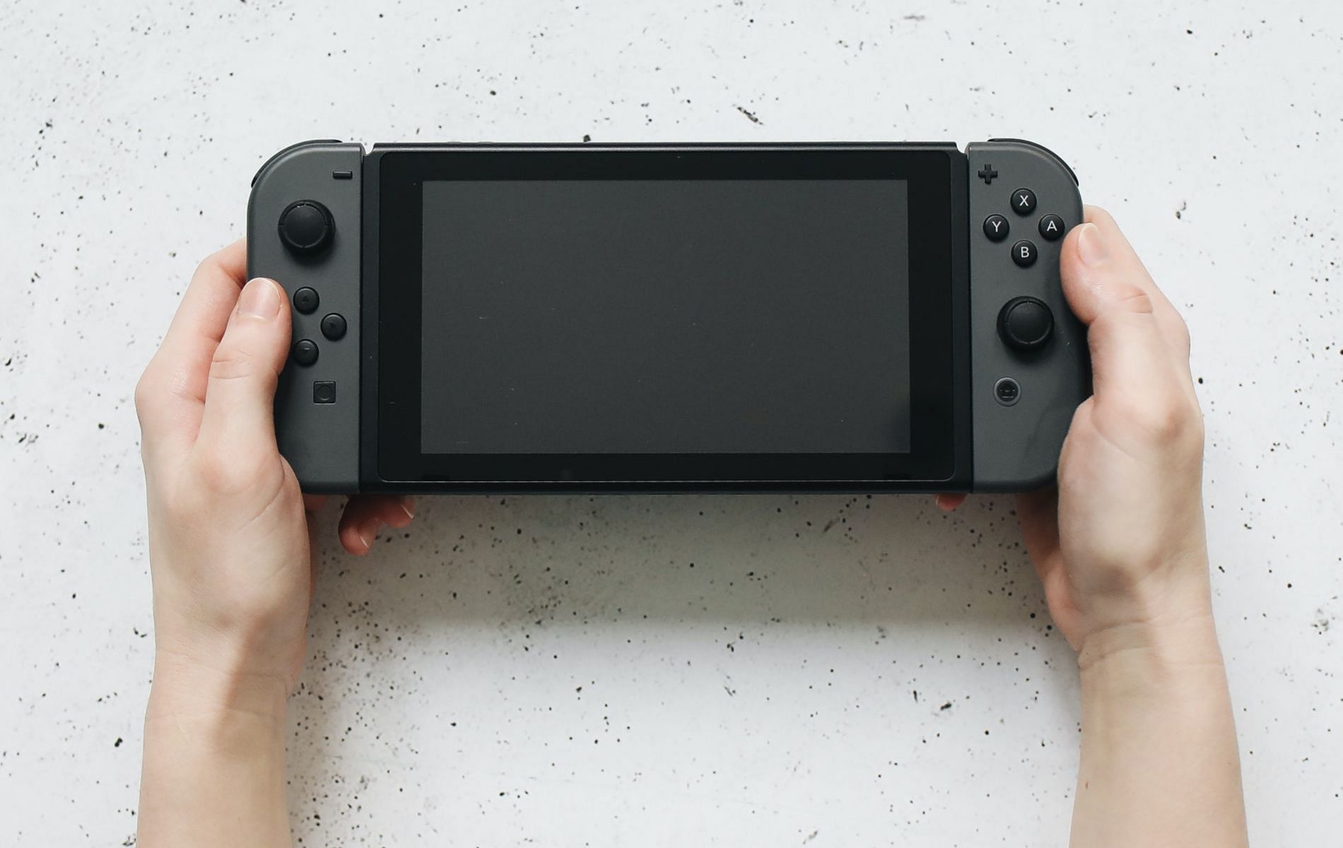 Stock image featuring the Nintendo Switch hybrid console