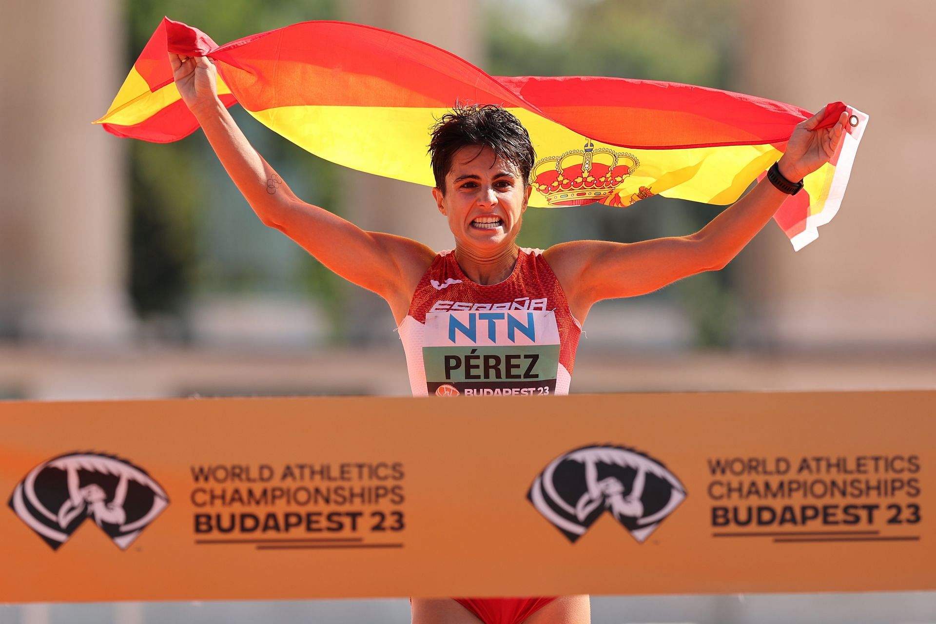 Maria Perez of Team Spain celebrates after winning Women&#039;s 35 Kilometres Race Walk Final
