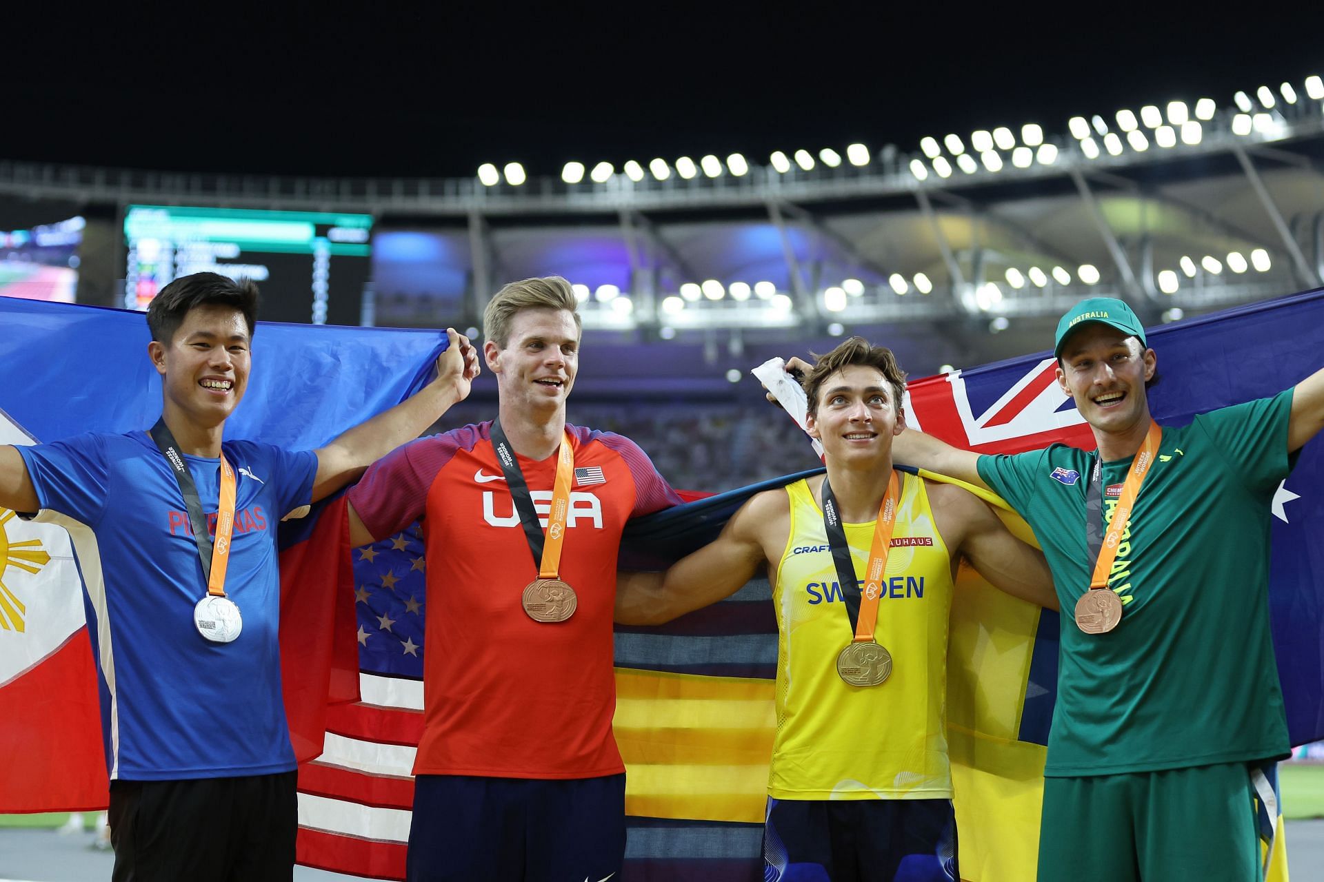 (L to R) Silver medalist Ernest John Obiena of Team Philippines, bronze Christopher Nilsen of Team United States, gold medalist Armand Duplantis of Team Sweden and bronze medalist Kurtis Marschall of Team Australia pose for a photo after the Men&#039;s Pole Vault Final during day eight of the World Athletics Championships Budapest 2023